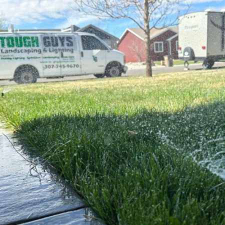 Tough Guys Sprinkler Installation and van in background
